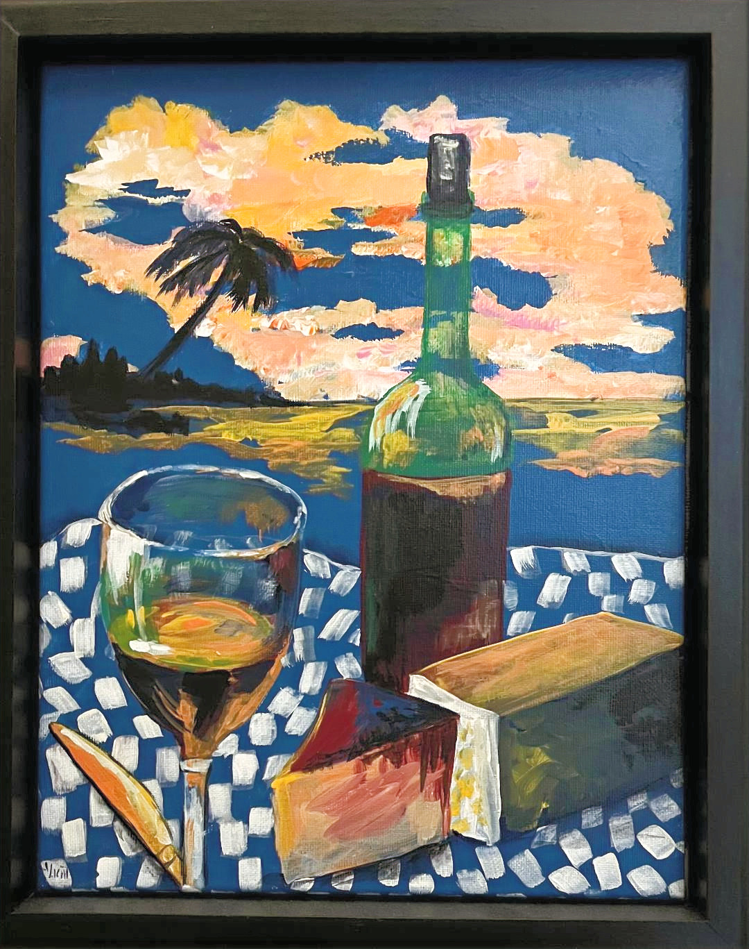 Still life of a wine bottle, a half-full glass and wedges of cheese on a blue and white checked cloth, with a palm and sunset clouds behind.